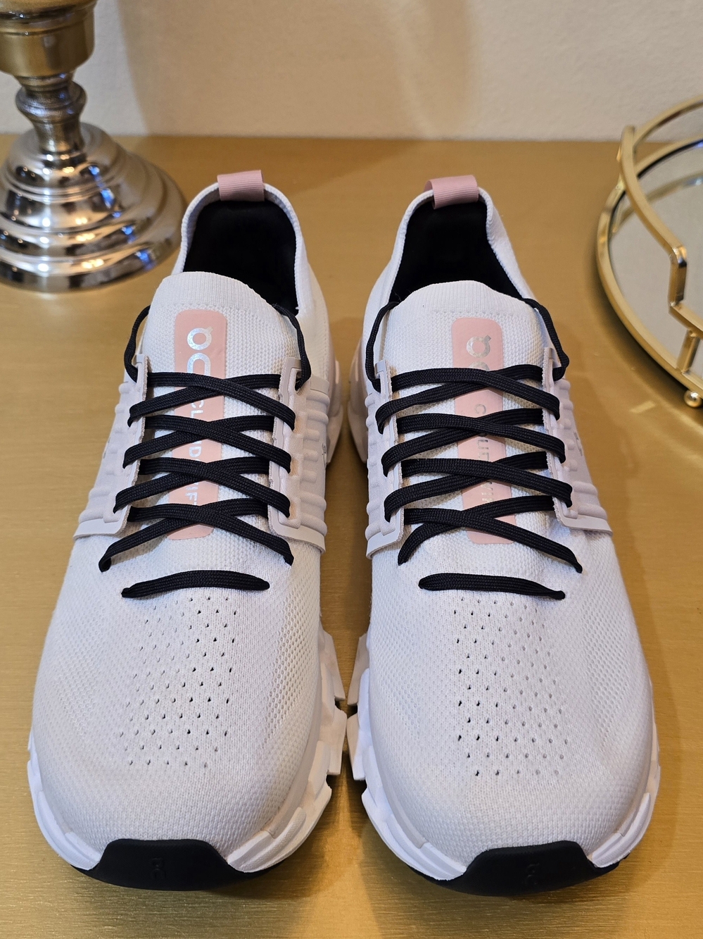 On Running Women’s White Sneakers with Pink Tongue Tabs and Black Laces